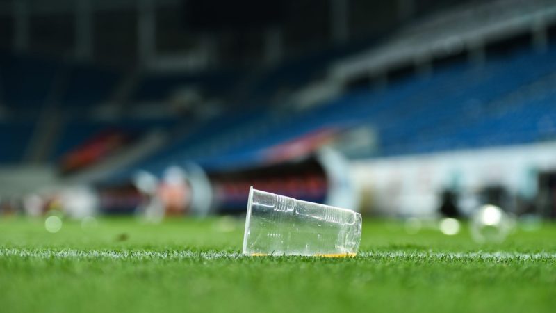 empty plastic cup on a soccer field