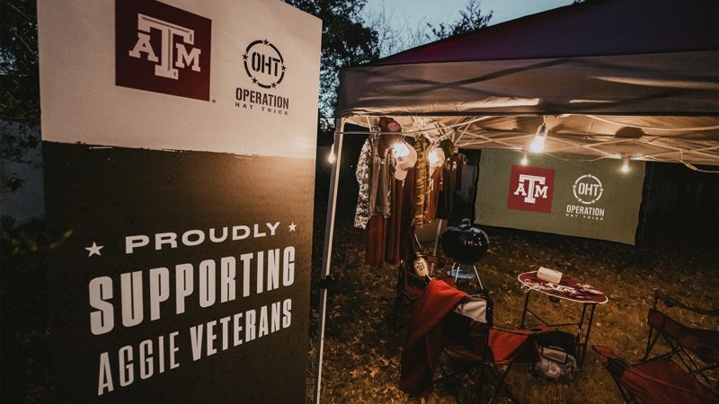 a photo of Max Kutch's backyard with the prizes and a sign that says Texas A&M and OHT, proudly supporting Aggie veterans