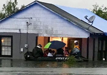 Members of Texas A&M Task Force 1 rescuing East Texas residents from flooding from Tropical Storm Imelda in September 2019