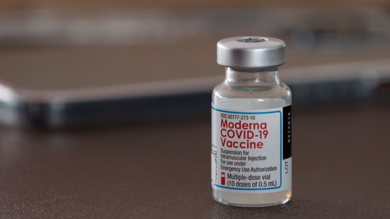 close up of a vial of the moderna covid-19 vaccine