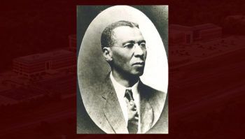 black and white portrait of cooper against maroon background
