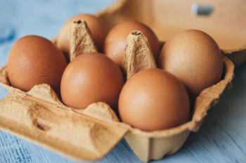 close up of eggs in a carton