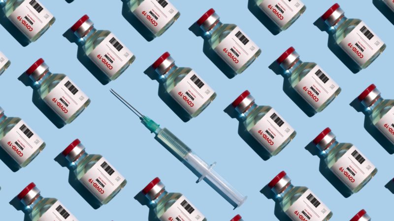 repeated vials and syringes against blue background