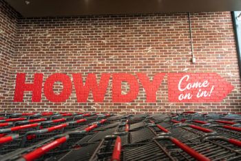 a photo of the word Howdy on a wall outside the store