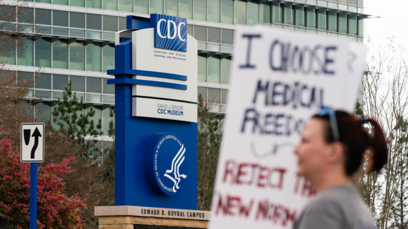 people protesting outside the CDC headquarters