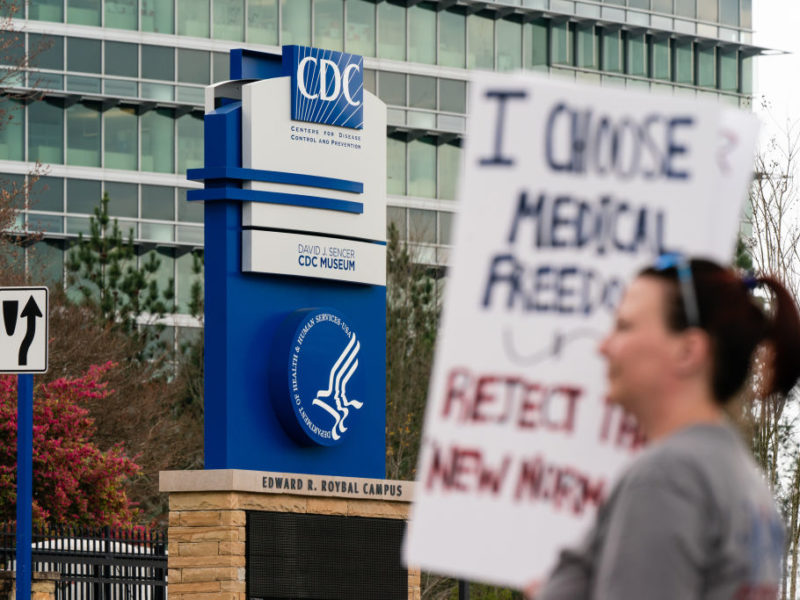people protesting outside the CDC headquarters