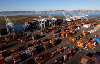 Shipping containers sit on a dock at the Port of Oakland on March 26, 2021 in Oakland, California. 