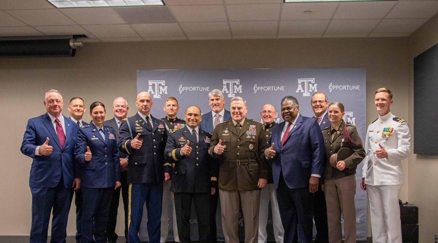 University and System officials pose with Gen. Milley