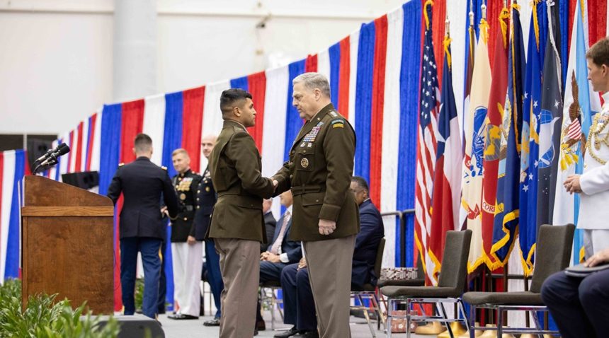 Milley shaking hands with a graduating cadet