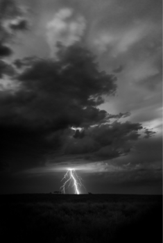 black and white photo of a lightning strike