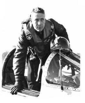 frazier climbing out of the cockpit of an airplane