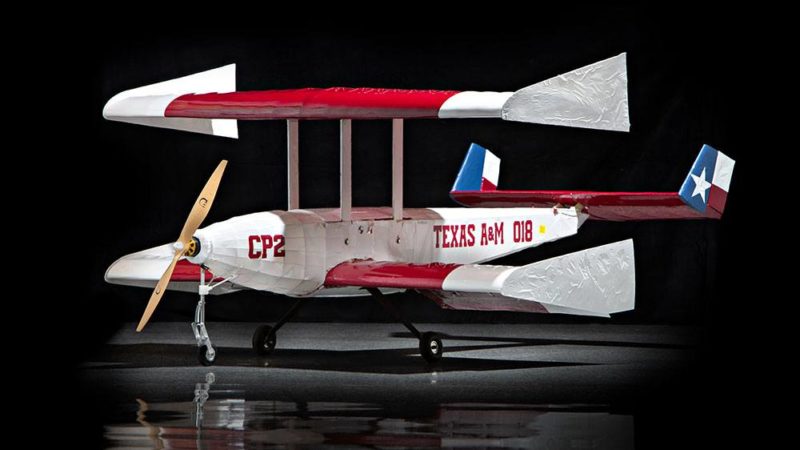 image of the team's biplane aircraft against a black background