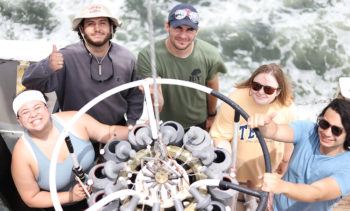 students on board gathered around ctd rosette