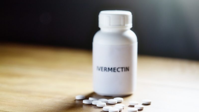 pill bottle that says ivermectin sitting on a table