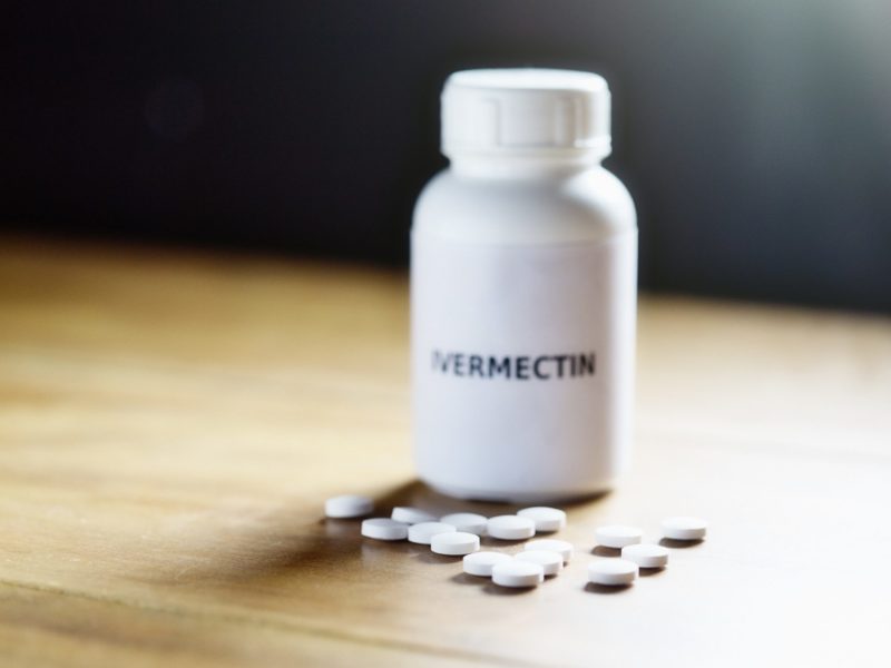 pill bottle that says ivermectin sitting on a table