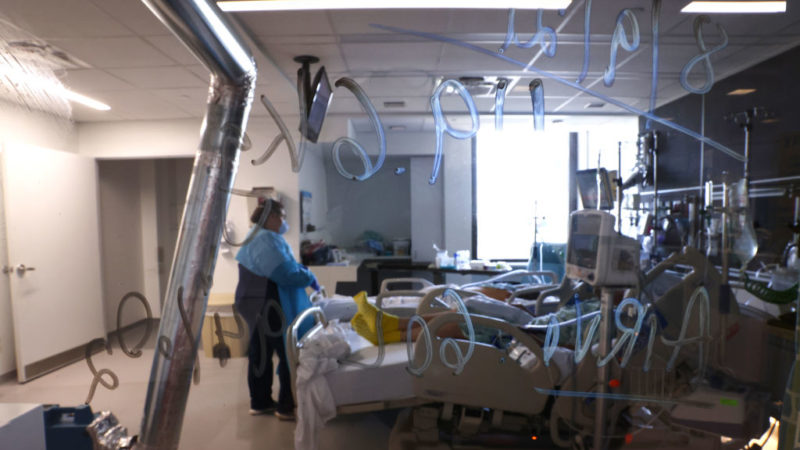 view through a window into an icu unit in a hospital