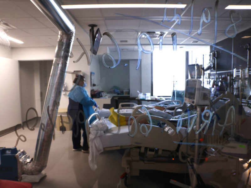 view through a window into an icu unit in a hospital