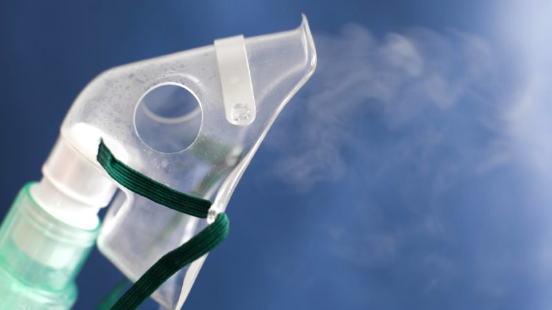 oxygen mask against blue background