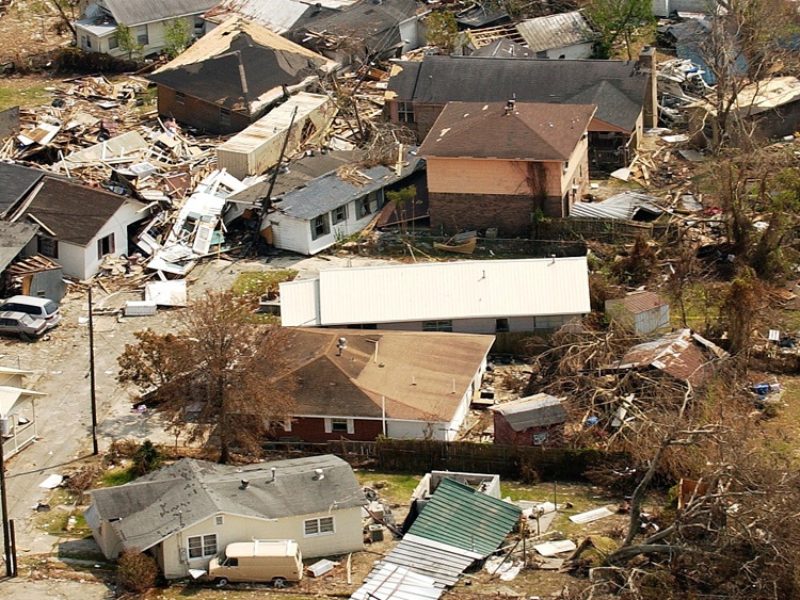 overhead view of destroyed houses in neighborhood after hurricane