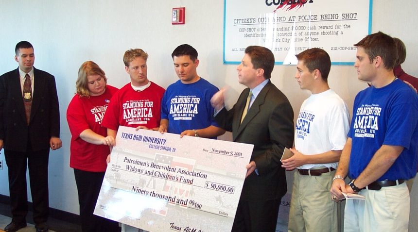 RWB student organizers presenting a check for $90,000 to the Patrolmen's Benevolent Association Widows' and Children's Fund