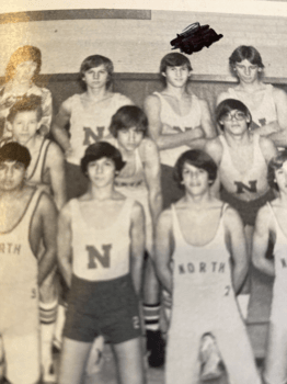 black and white yearbook photo of a basketball team including Hurtado
