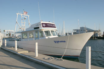 a docked boat named "karma"
