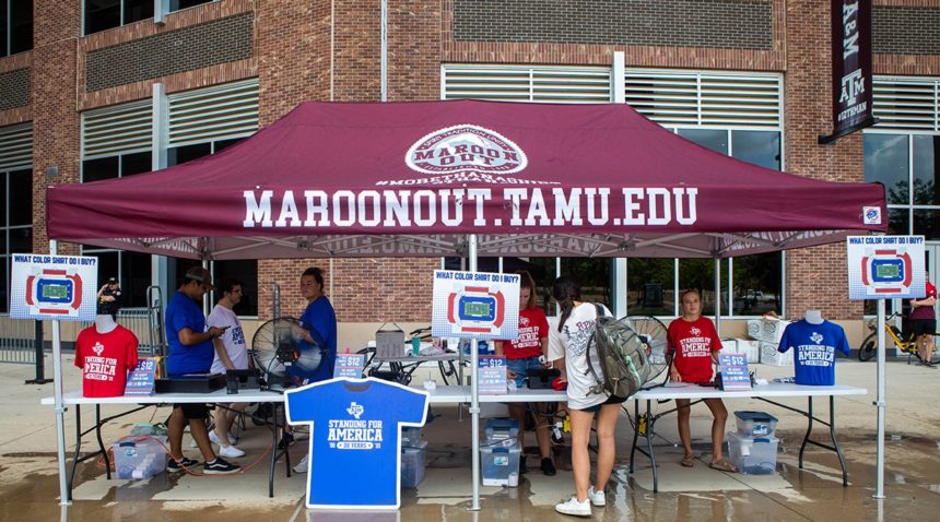 the maroon out tent and students selling shirts