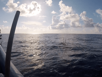 the glider floating on the water in the ocean