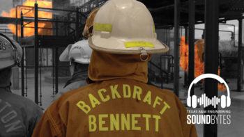 view of back of man's jacket that says "backdraft bennett" as he stands in front of a fire