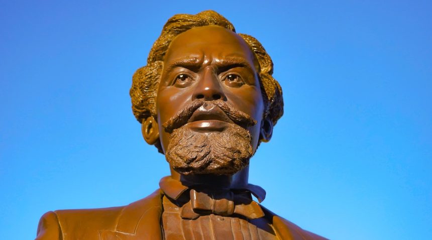 close up on face of bronze matthew gaines statue