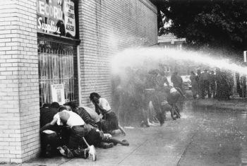 BIRMINGHAM, AL - MAY 1963: A water cannon is used on young African Americans during a protest against segregation, organized by Reverend Dr. Martin Luther King Jr. and Reverend Fred Shuttlesworth, in Birmingham, Alabama, May 1963.