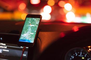 map on a phone mounted to a car dashboard