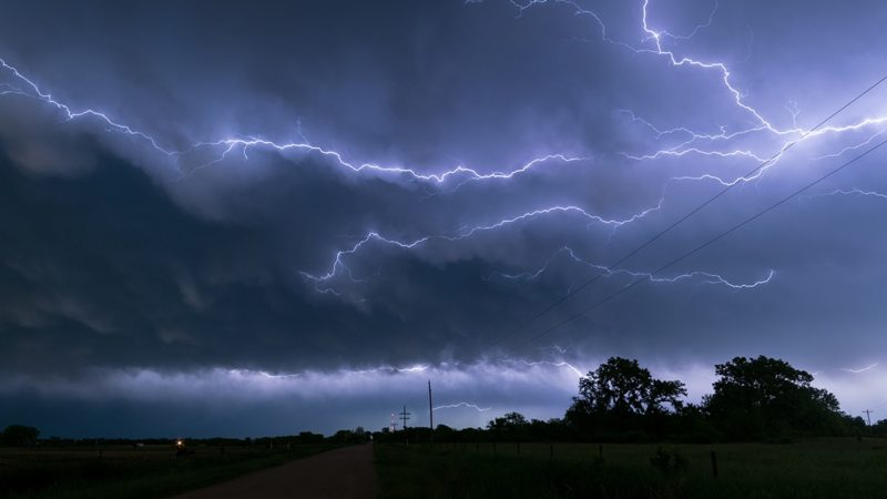 a flash of lightning moving horizontally across the sky