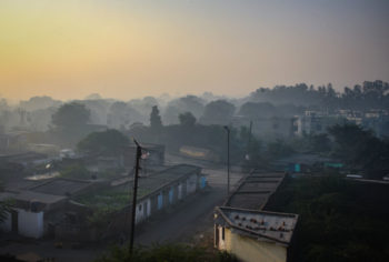 smog lies over a residential neighborhood in india