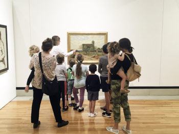 a group of visitors in the galleries