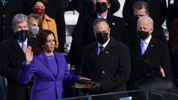 WASHINGTON, DC - JANUARY 20: Kamala Harris is sworn in as U.S. Vice President as her husband Doug Emhoff looks on during the inauguration of U.S. President-elect Joe Biden on the West Front of the U.S. Capitol on January 20, 2021 in Washington, DC. During today's inauguration ceremony Joe Biden becomes the 46th president of the United States. (Photo by Alex Wong/Getty Images)