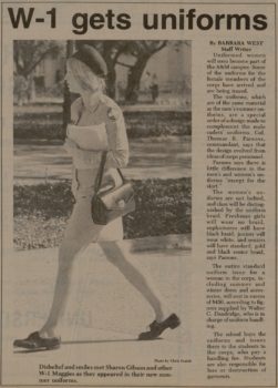 a newspaper clip with the headline "w-1 gets uniforms" above a photo of a female cadet wearing khaki shirt and skirt with a black beret