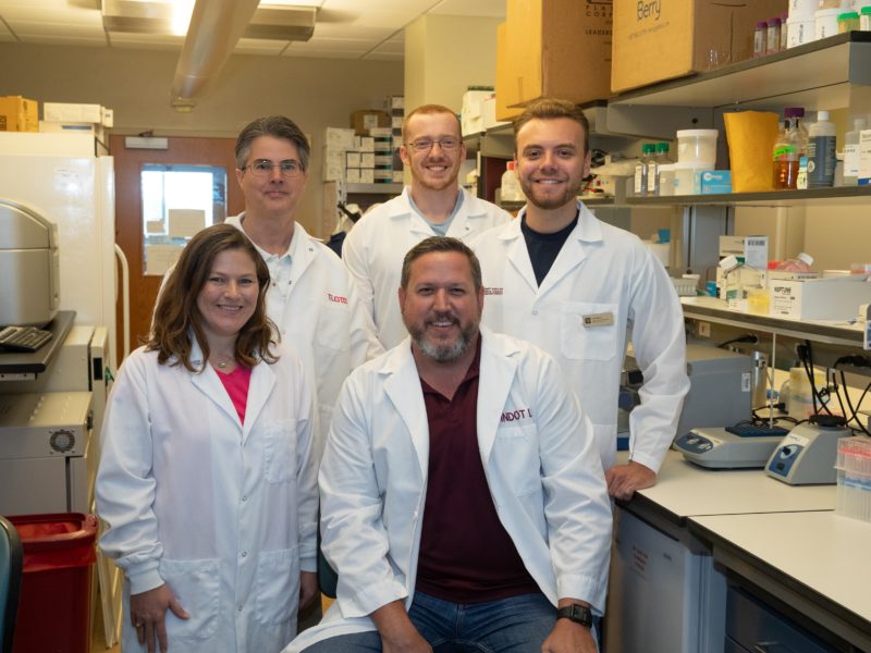 The Dindot Lab team, including Dr. Scott Dindot (front right); Dr. Sarah Christian (front left); (back row l-r) Dr. Johnathan Ballard, Texas A&M Institute for Genomic Medicine; and biomedical sciences doctoral students Luke Myers and Tom Jepp.