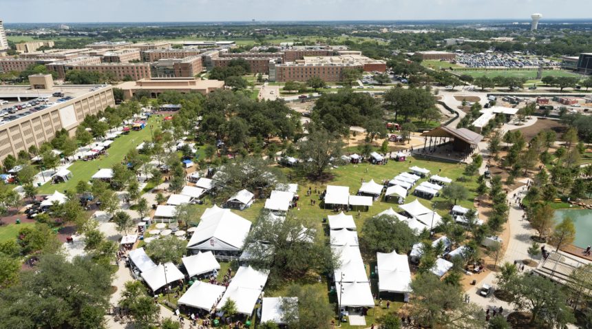 an overhead shot of the Aggie Park grand lawn full of tents and people
