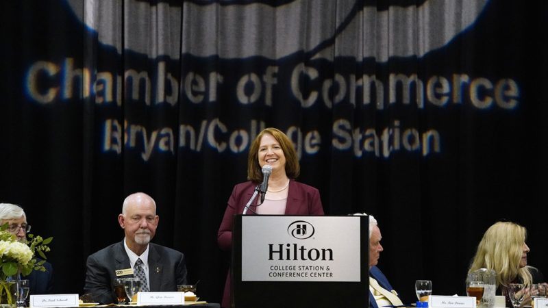President Banks standing at the podium at the 2022 Bryan-College Station Chamber of Commerce Annual Banquet
