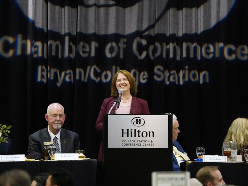 President Banks standing at the podium at the 2022 Bryan-College Station Chamber of Commerce Annual Banquet