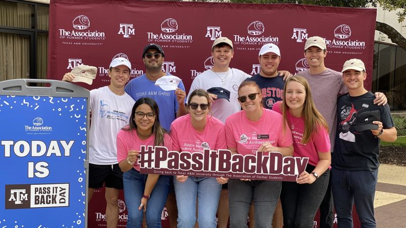a group of students on pass it back day at the association building