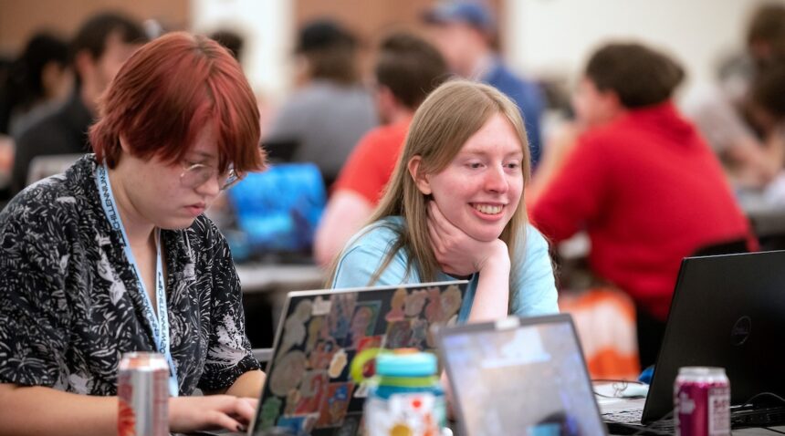 Two college students work on creating a game at the Chillennium game jam.