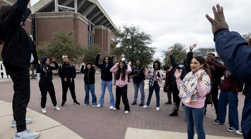 A tour group outside Kyle Field