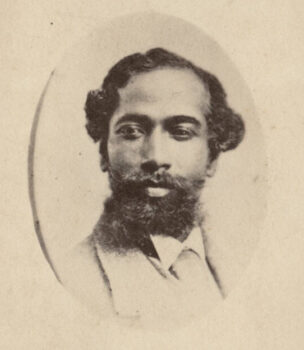 a black and white photo of a Matthew Gaines with a full beard