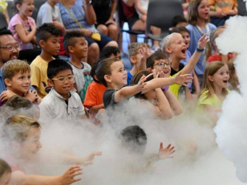 children in the audience during one of the science experiments at the Physics and Engineering Festival