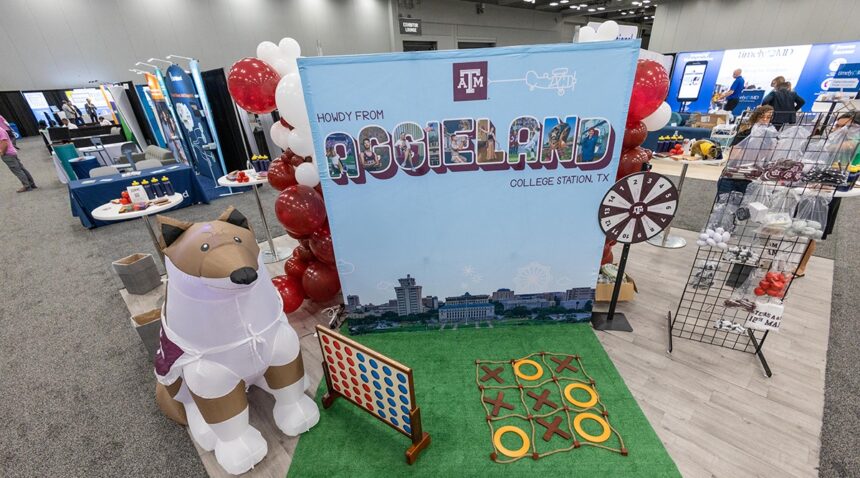 the A&M booth at SXSW EDU 2023 with games and a giant inflatable Reveille