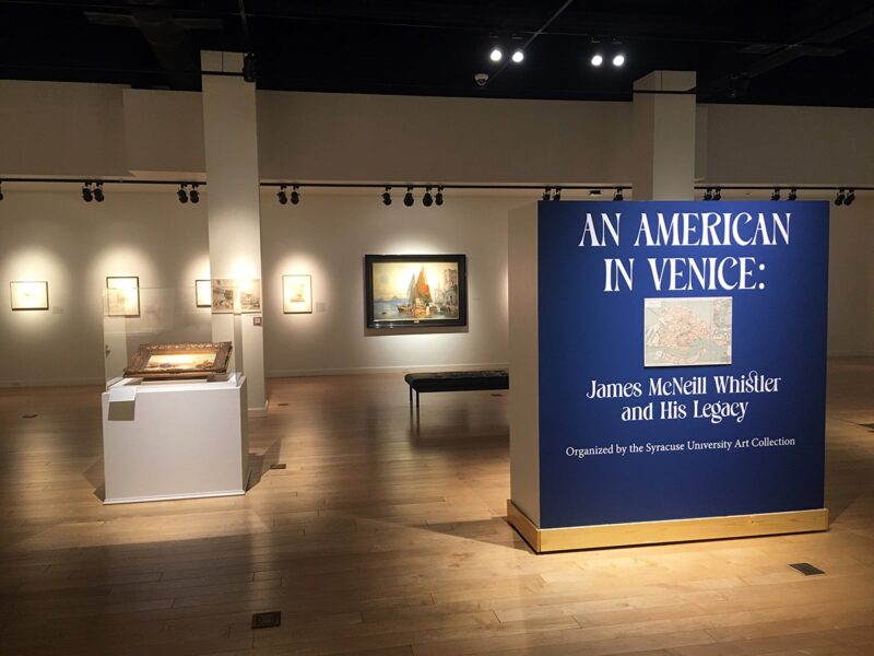 The opening area of the exhibit with a sign reading An American In Venice: James McNeill Whistler and His Legacy