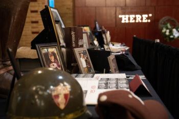 A table filled with memorabilia on display for Muster