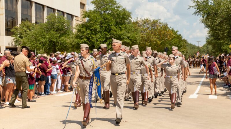 a photo of cadets marching on campus.